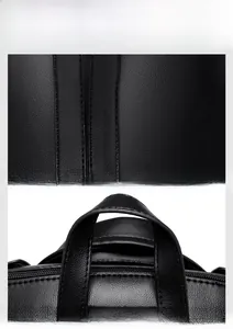 Detail of high-quality black grained leather fabric and reinforced top handle stitching