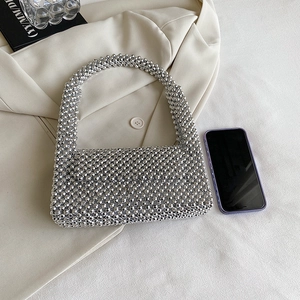 Chic silver beaded mini handbag with metallic finish and top handle for evening events