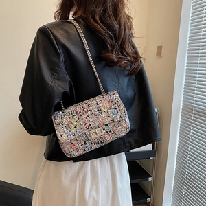 Graffiti print silver chain crossbody bag for women with metallic turn-lock closure