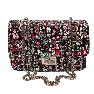 Graffiti print chain shoulder bag with metallic lock and silver chain for women