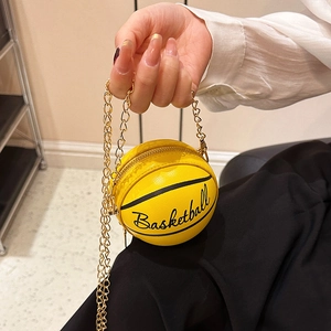 Mini yellow basketball-shaped crossbody bag with gold chain strap for women