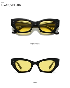 Détail macro de lunettes ovales noires avec verres jaunes et accents en métal argenté