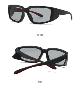 Détail de lunettes de soleil de sport carrées noir mat avec intérieur rouge contrasté