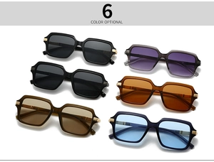 Flat lay of retro pilot sunglasses in six colors with metallic temple accents