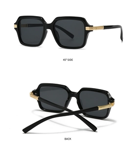 Detail view of square pilot sunglasses with gold metal hinges and thick black frames