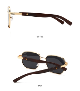 Macro detail of square sunglasses with gold metal frame and wooden texture temples