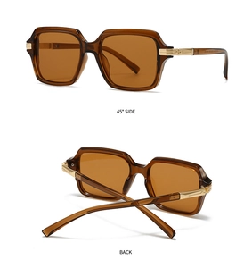 Detail view of retro square aviator sunglasses with amber frames and gold hinges
