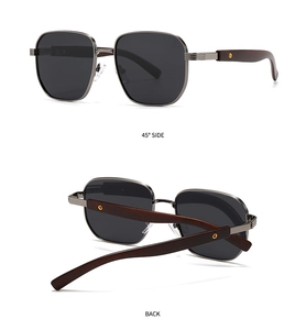 Detail of square polarized sunglasses with dark gray lenses and brown wood texture temples