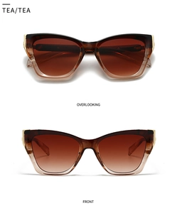 Detail view of tea brown gradient aviator sunglasses showing gold metal hinge accents
