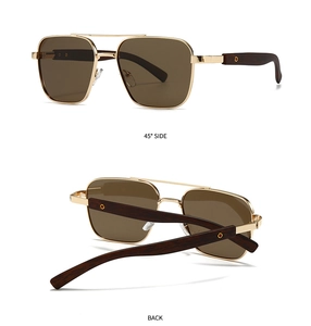 Detailed view of square polarized sunglasses with gold metal frame and wood grain temples