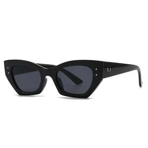 Lunettes de soleil œil-de-chat noires ovales rétro avec monture épaisse et rivets
