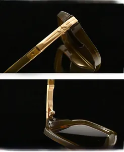 Detail of square amber aviator sunglasses showing high-quality metal hinge construction