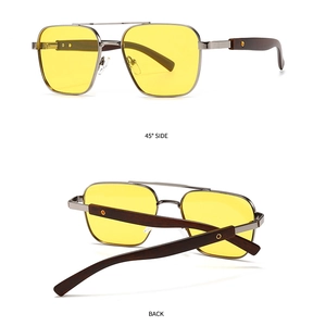 Detail view of square yellow lens sunglasses with metal bridge and wood texture temples