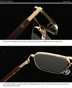 Detail of square polarized sunglasses with gold metal rims and brown wood grain temples