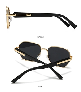 Détails de lunettes de soleil polarisées avec verres noirs et monture dorée chic