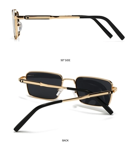Detail view of rectangular polarized sunglasses with gold metal frame and black side temples