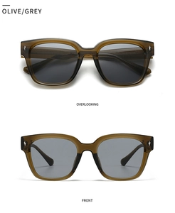 Detail view of retro olive brown sunglasses with grey lenses and silver star accents