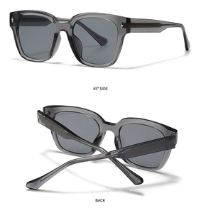 Detail view of retro sunglasses with translucent grey frame and silver star rivets