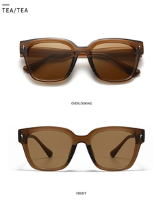 Detail of tea-colored oversized sunglasses featuring vintage silver star rivets and frames
