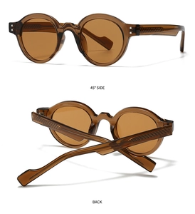 Detail view of tortoiseshell round sunglasses with metal studs and textured inner temples