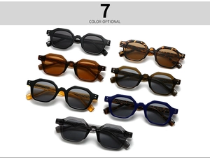 Flat lay display of retro polygon sunglasses in seven diverse frame and lens color options