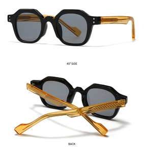 Detailed view of retro polygon sunglasses featuring black frames and amber textured temples
