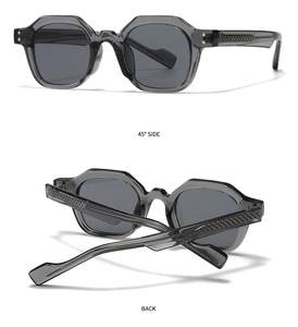 Detail view of grey translucent geometric sunglasses with woven textured temples and 45 degree angle