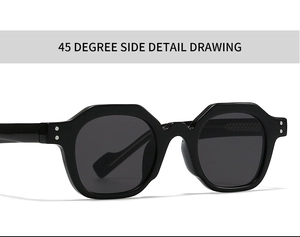 Detail view of bold black polygonal sunglasses featuring silver rivets and wide temples