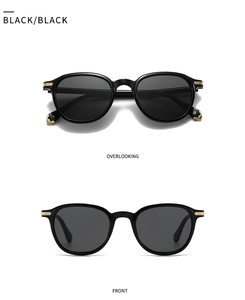 Top and front view of retro black sunglasses with gold metal hinges on a white background