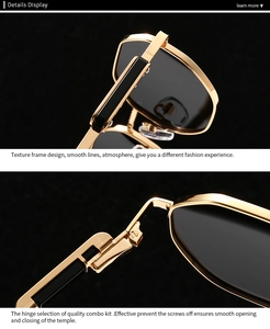 Detail view of durable golden metal hinges and black temple arms on polygon sunglasses
