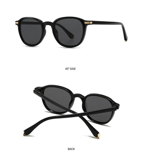 Detail view of black full-frame sunglasses with golden metal accents from 45 degree angle