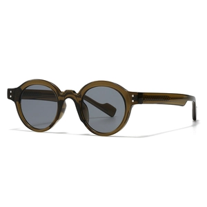 Retro round frame sunglasses in translucent olive green with silver rivets and grey lenses
