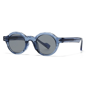 Trendy round sunglasses with translucent blue frames and dark grey lenses for women