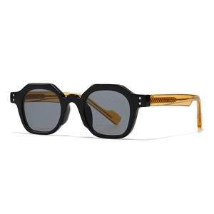 Vintage geometric sunglasses with thick black frame and amber temples on white background