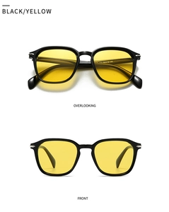 Detail view of square sunglasses with black frame and yellow transparent lenses
