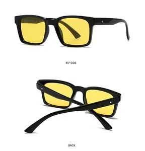 Detailansicht der quadratischen Sonnenbrille mit gelben Gläsern und silbernen Nieten