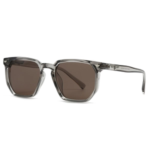 Transparente graue sechseckige Sonnenbrille mit braunen Gläsern und Logo-Metalldetail