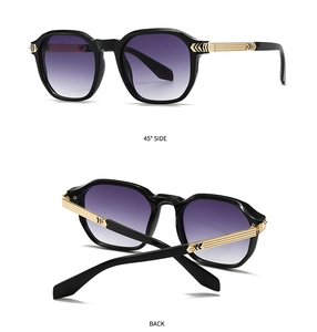 Detail of black polygonal sunglasses with gold striped metal temples and 45-degree view