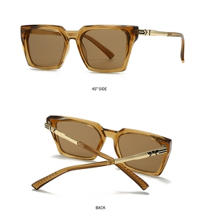 Detail of amber square sunglasses with golden metal temples and dark brown lenses