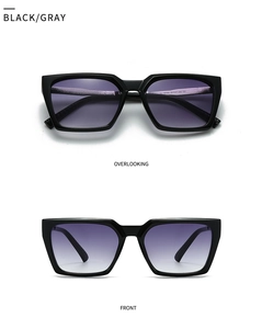 Close-up of black frame sunglasses with purple gradient lenses showing size specs
