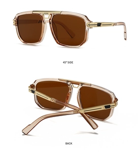 Detail view of modern retro oversized sunglasses with amber frames and gold accents