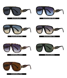 Detailed grid of oversized square sunglasses featuring gold metal accents and colorful lenses