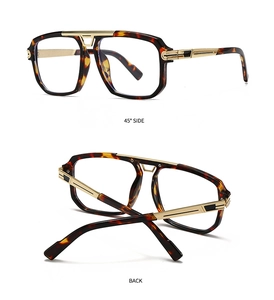 Detail view of large retro aviator frames with gold metal bridge and tortoise temples
