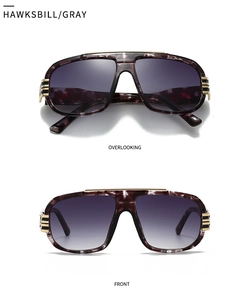 Detail view of modern oversized aviator sunglasses with purple tortoiseshell frame and metal bars