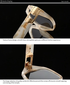 Detail of cream marble frame texture and golden T-hinge on modern sunglasses