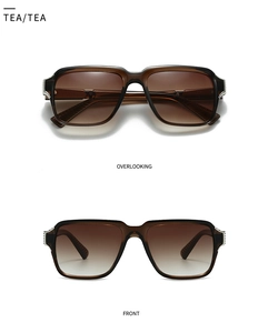 Detail of translucent tea brown sunglasses with silver metal accents and gradient lenses