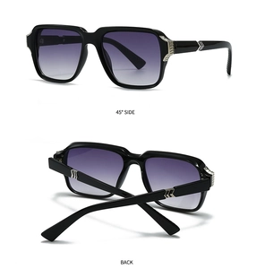 Detail view showing silver V-shaped metal accents and gradient lenses on black sunglasses