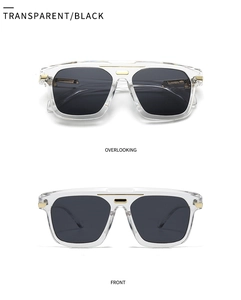 Macro view of transparent oversized sunglasses with gold metal trim and dark grey lenses