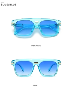 Detail view of modern oversized sunglasses with transparent blue frame and gold accents