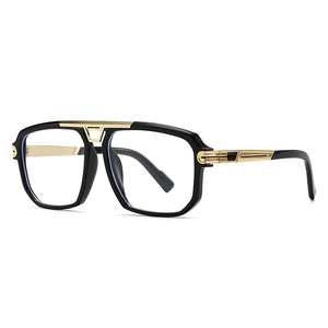 Modern vintage oversized pilot sunglasses with black frame and gold metal accents